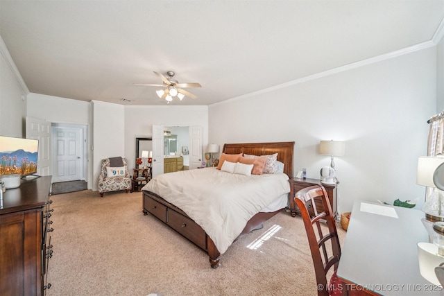 bedroom featuring ornamental molding, ensuite bath, a ceiling fan, and light colored carpet