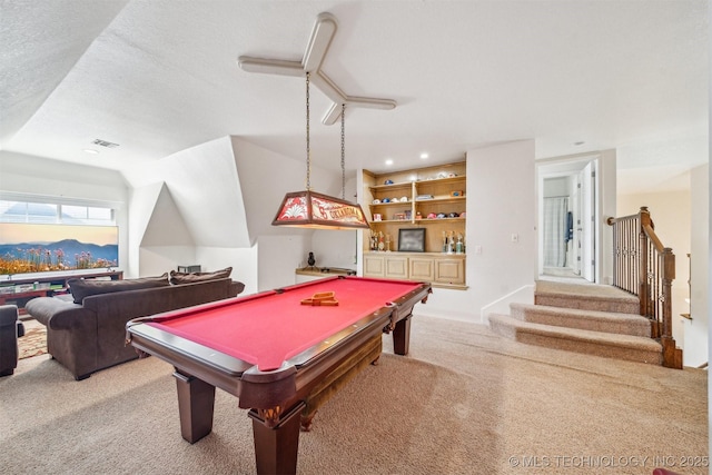 game room with a textured ceiling, carpet floors, pool table, visible vents, and a dry bar