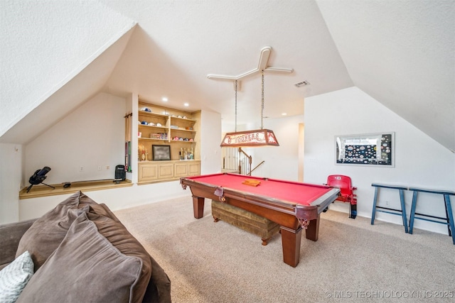 game room featuring a textured ceiling, carpet floors, pool table, visible vents, and vaulted ceiling