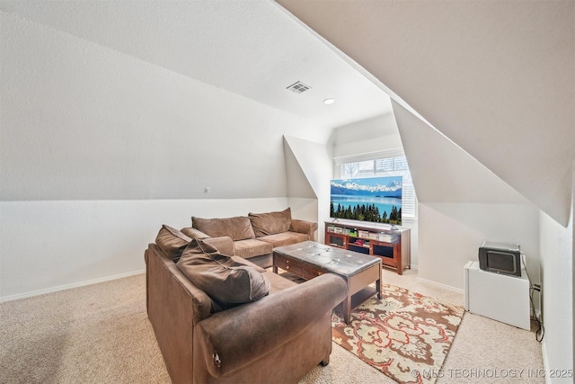 living area featuring light carpet, lofted ceiling, visible vents, and baseboards