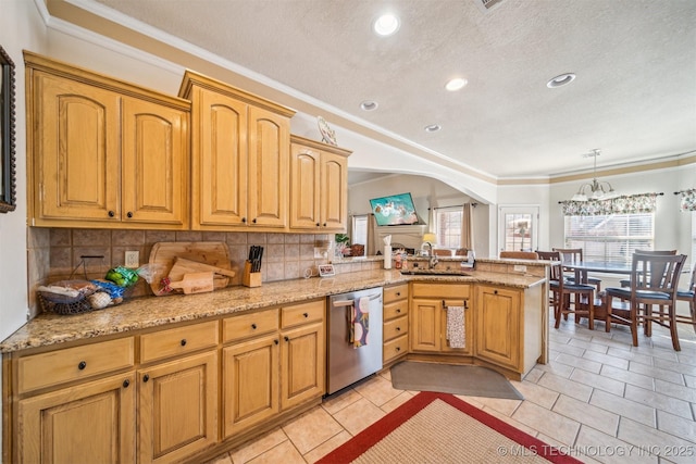 kitchen featuring arched walkways, decorative backsplash, a peninsula, stainless steel dishwasher, and a sink