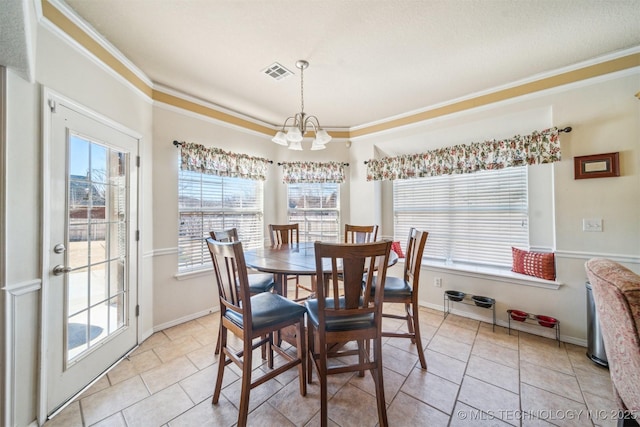 dining room with visible vents, a chandelier, and a wealth of natural light