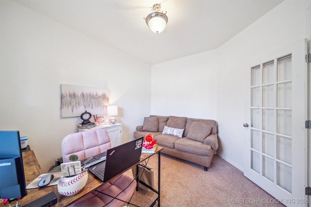 carpeted office space featuring baseboards