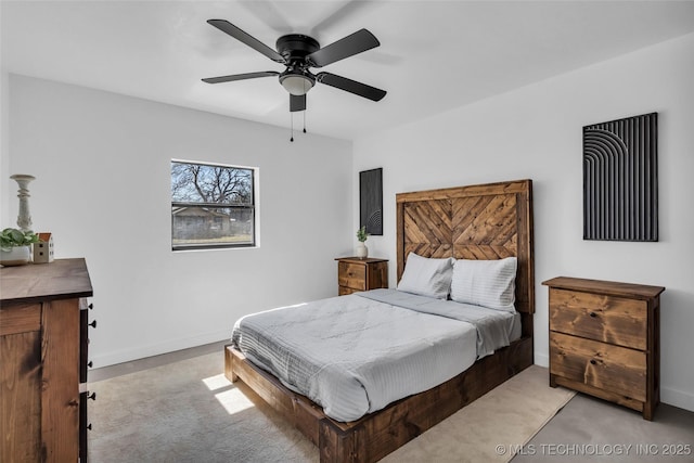 bedroom featuring light carpet, ceiling fan, and baseboards