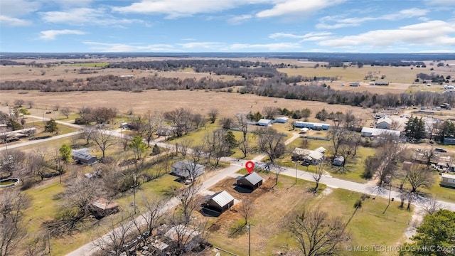 birds eye view of property with a rural view