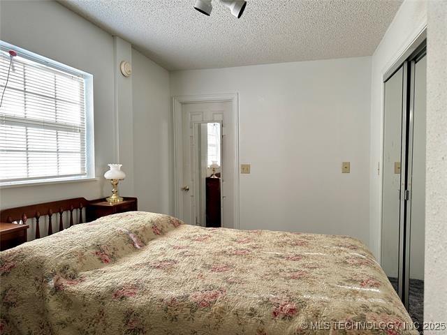 bedroom featuring a textured ceiling