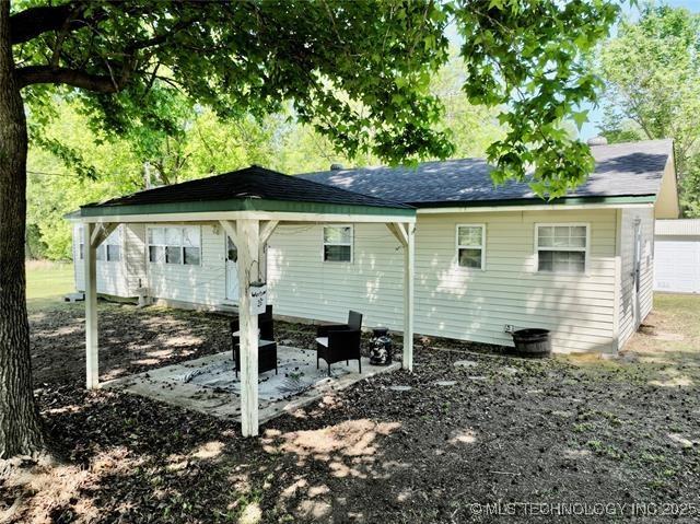 rear view of property featuring a patio