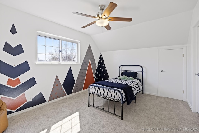 bedroom featuring lofted ceiling, ceiling fan, and carpet flooring