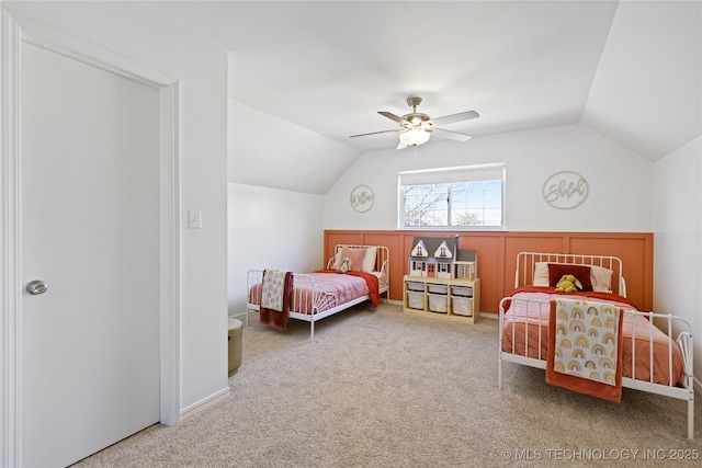 bedroom with carpet floors, lofted ceiling, and a ceiling fan