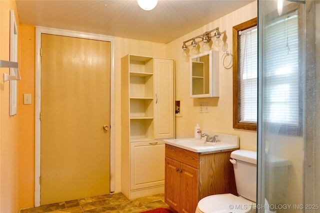 full bathroom featuring vanity and toilet