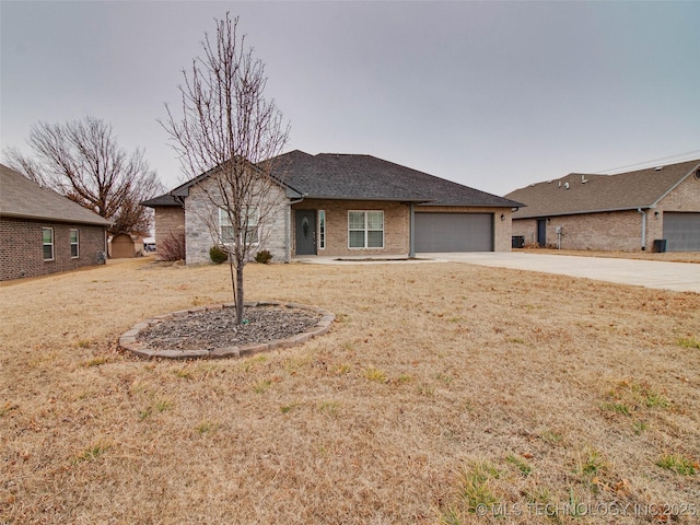 single story home with driveway, brick siding, a shingled roof, an attached garage, and a front yard