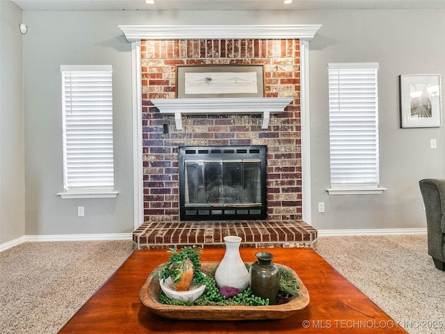 living room featuring carpet, a brick fireplace, and baseboards