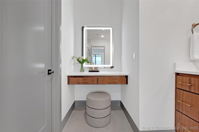 227 E 35th St, Tulsa, OK 74105 - bathroom with baseboards and vanity