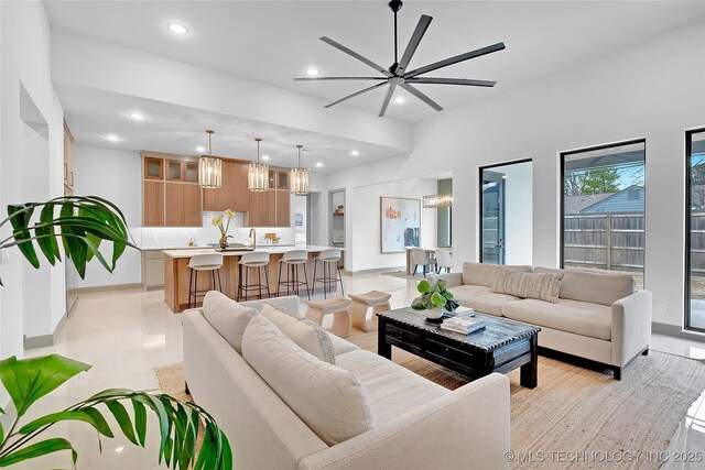 227 E 35th St, Tulsa, OK 74105 - living room with a chandelier, recessed lighting, ceiling fan, and baseboards