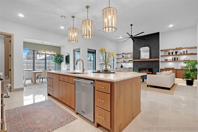 227 E 35th St, Tulsa, OK 74105 - kitchen featuring a sink, dishwasher, a tiled fireplace, ceiling fan, and a chandelier