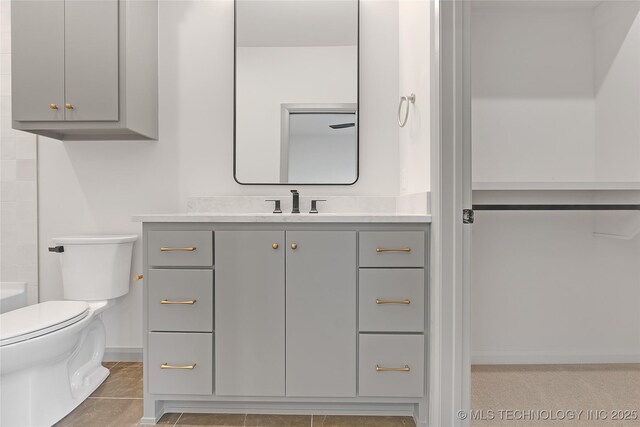 227 E 35th St, Tulsa, OK 74105 - bathroom with vanity, toilet, and baseboards