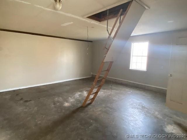 garage featuring baseboards