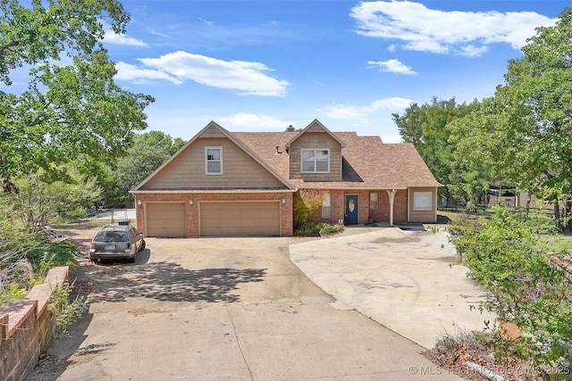 1474 S 271st W Ave, Sand Springs, OK 74063 - view of front facade featuring brick siding, concrete driveway, and a garage