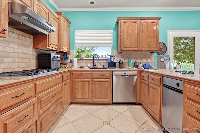 1474 S 271st W Ave, Sand Springs, OK 74063 - kitchen with under cabinet range hood, stainless steel appliances, light countertops, a sink, and decorative backsplash