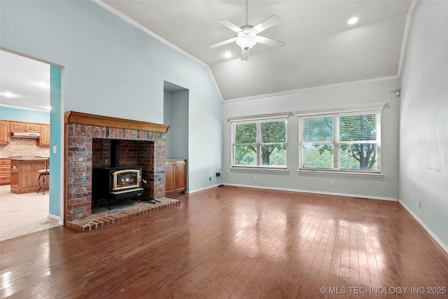 1474 S 271st W Ave, Sand Springs, OK 74063 - unfurnished living room featuring crown molding, ceiling fan, a wood stove, light wood-style flooring, and high vaulted ceiling