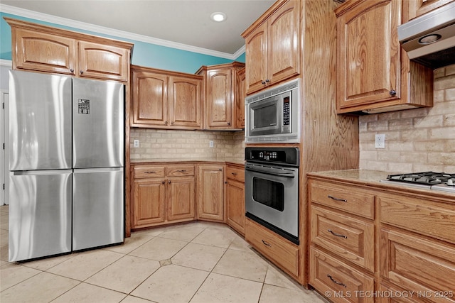 1474 S 271st W Ave, Sand Springs, OK 74063 - kitchen featuring appliances with stainless steel finishes, crown molding, light countertops, tasteful backsplash, and light tile patterned floors