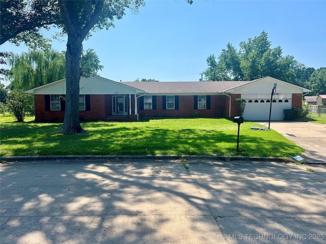 ranch-style house featuring an attached garage, brick siding, driveway, and a front lawn