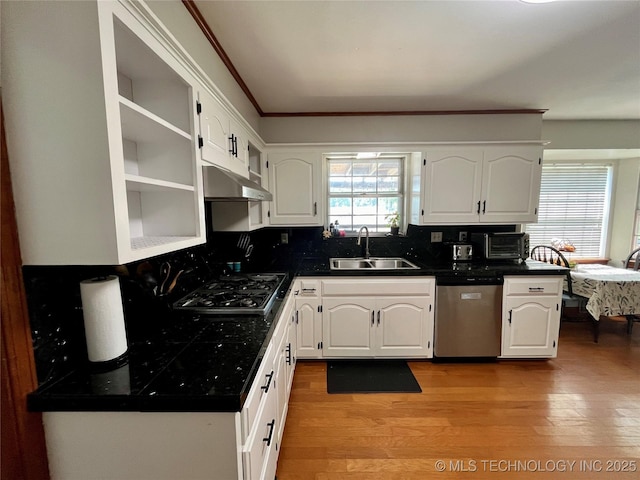 kitchen with gas cooktop, white cabinets, dishwasher, and a sink