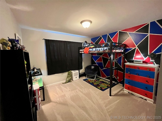 carpeted bedroom with freestanding refrigerator