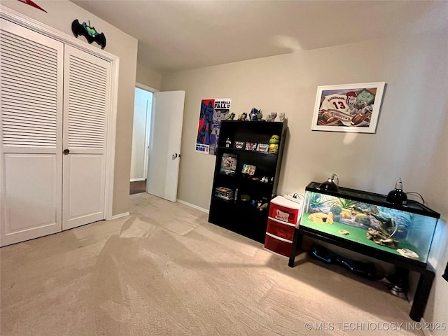 game room featuring light colored carpet