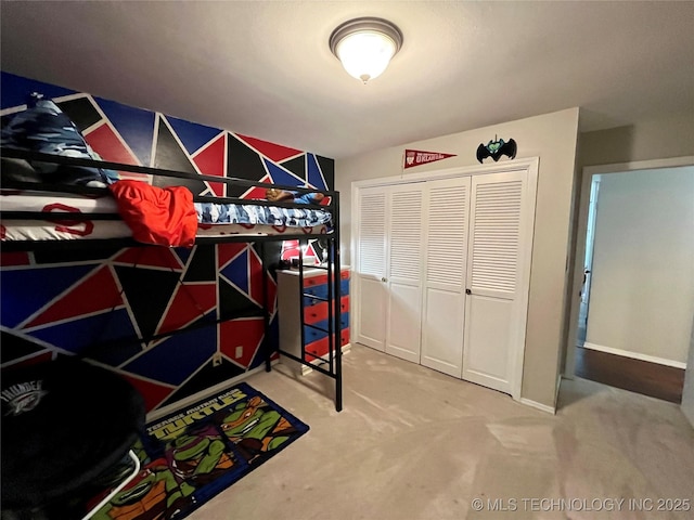 carpeted bedroom featuring a closet