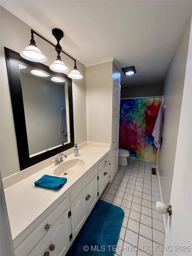 bathroom with toilet, curtained shower, tile patterned flooring, and vanity