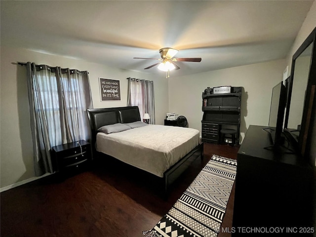 bedroom featuring ceiling fan and dark wood-style flooring