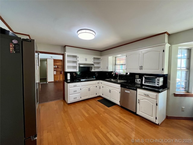 kitchen with stainless steel appliances, light wood-style floors, white cabinetry, open shelves, and a sink