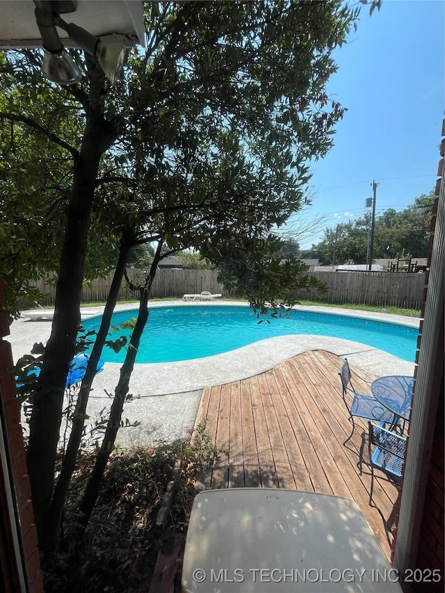 view of pool with a deck, a fenced backyard, and a fenced in pool