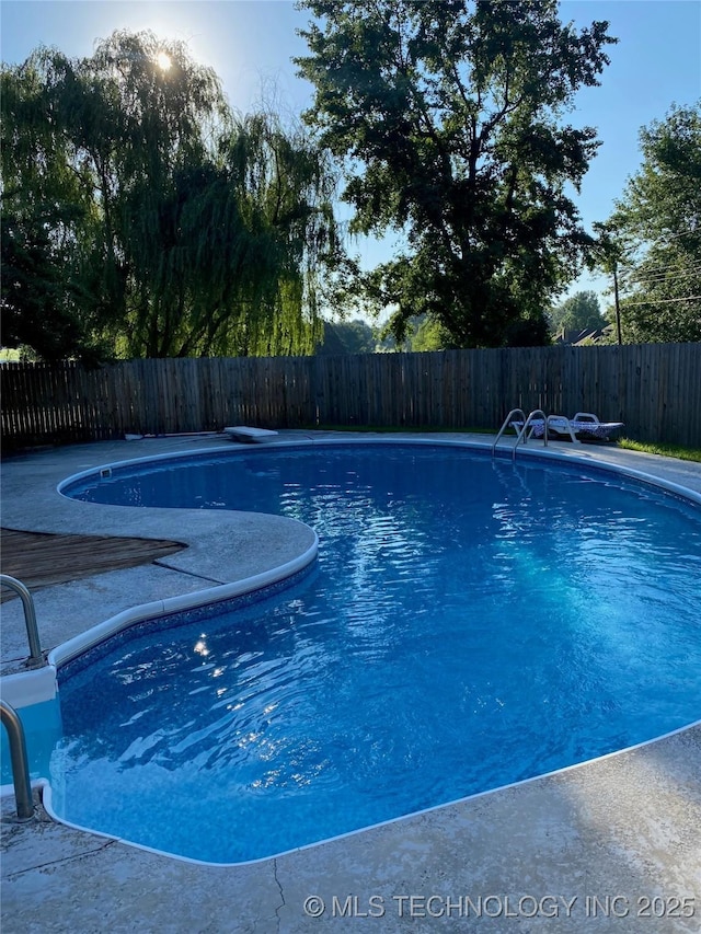 view of swimming pool featuring a fenced in pool and a fenced backyard