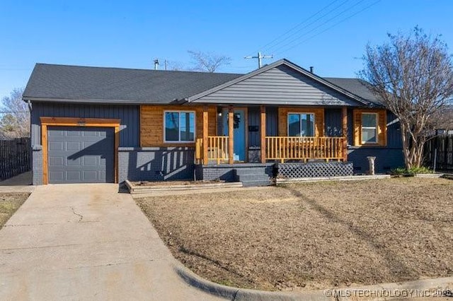 ranch-style house featuring a porch, concrete driveway, brick siding, and an attached garage