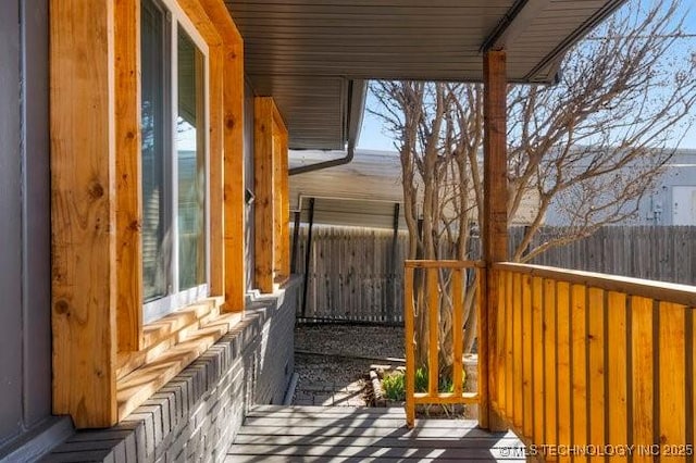 wooden deck featuring fence