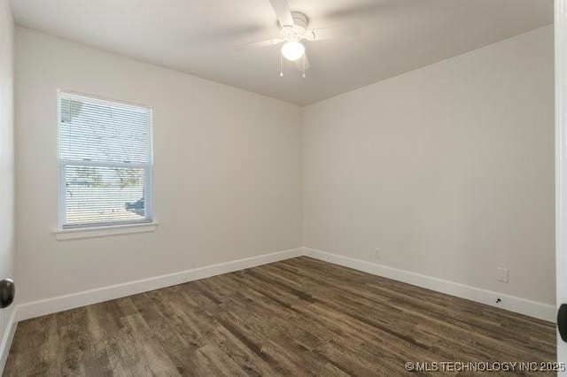 spare room with ceiling fan, baseboards, and wood finished floors