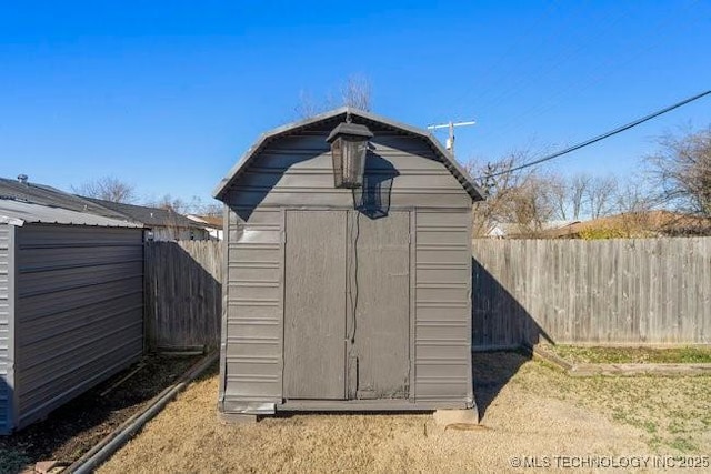 view of shed featuring a fenced backyard