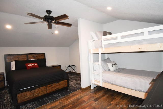 bedroom with lofted ceiling, wood finished floors, a ceiling fan, and baseboards