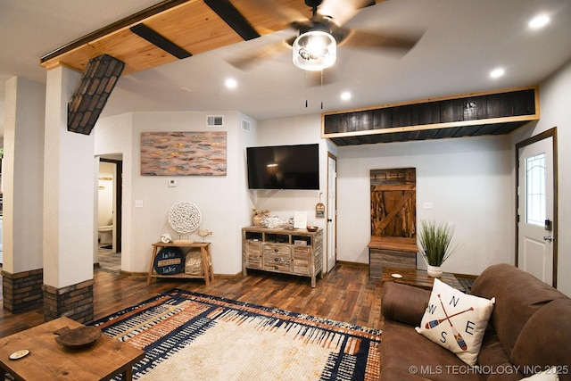 living area featuring baseboards, visible vents, a ceiling fan, and dark wood-style flooring