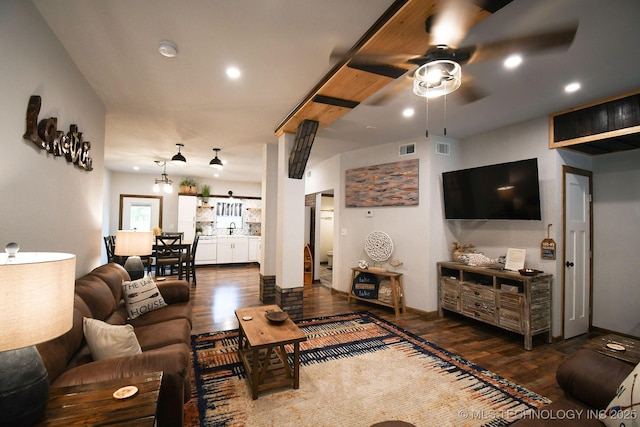 living room featuring recessed lighting, visible vents, and wood finished floors