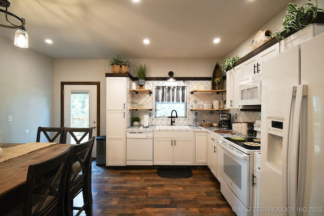 kitchen with tile countertops, white appliances, a sink, backsplash, and open shelves