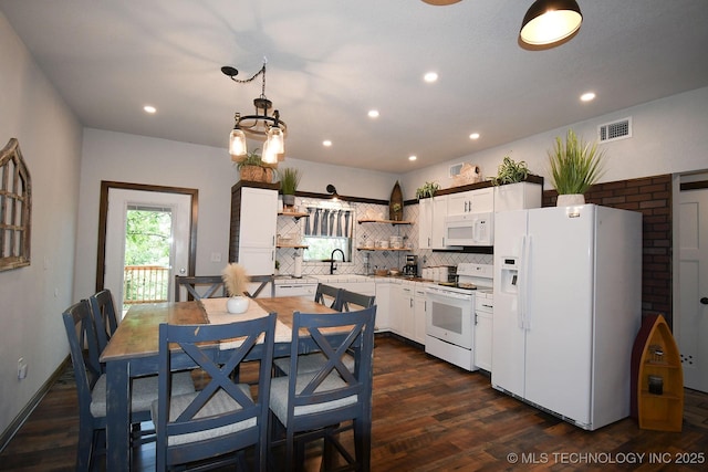 kitchen with open shelves, tasteful backsplash, visible vents, a sink, and white appliances