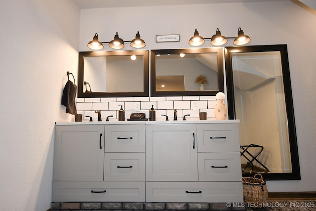 bathroom with a sink and double vanity