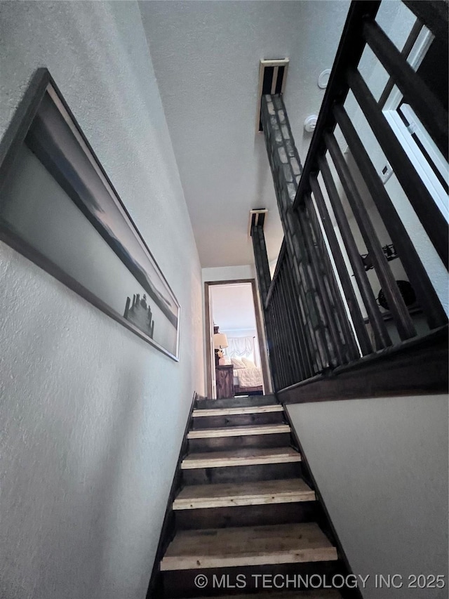 stairs with wood finished floors