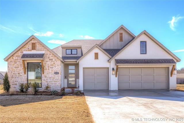 view of front of property featuring roof with shingles, concrete driveway, an attached garage, board and batten siding, and stone siding