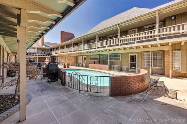 outdoor pool with a patio