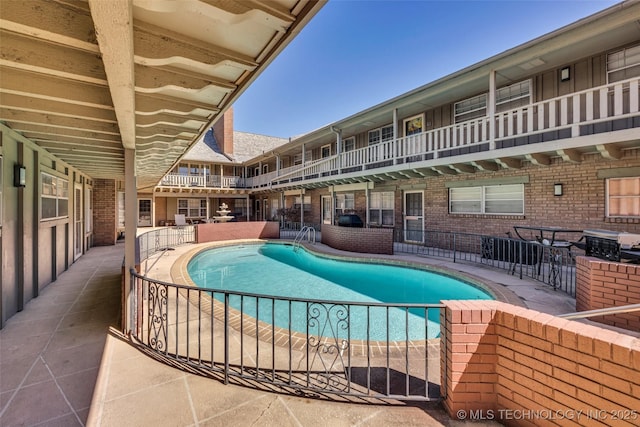 outdoor pool featuring a patio area