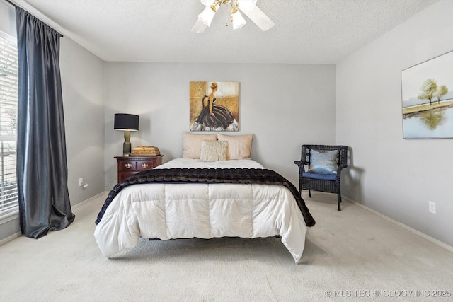 bedroom with carpet flooring, a textured ceiling, and baseboards